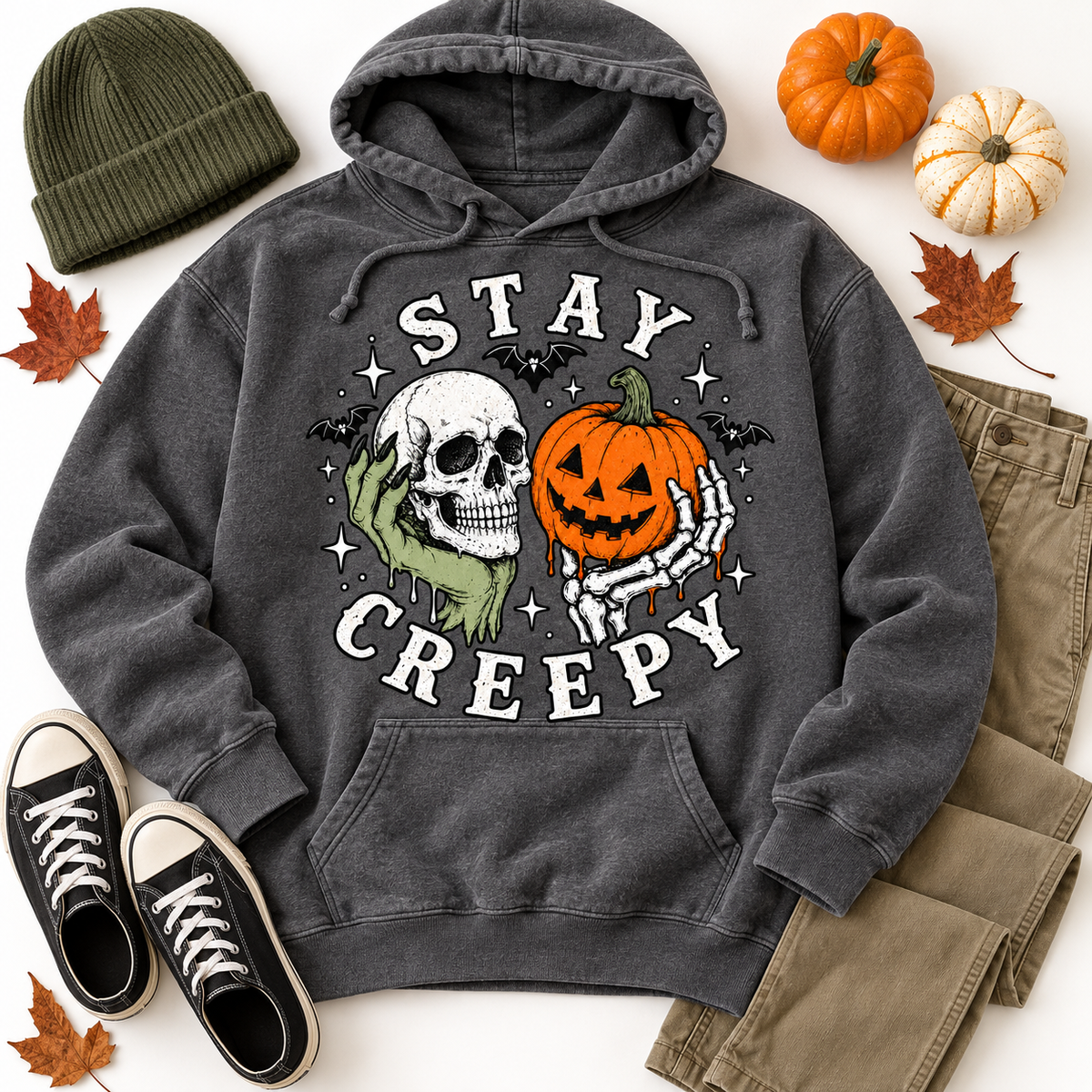 Stay Creepy hoodie in Charcoal mineral wash — styled fall flat lay with beanie, pumpkins and sneakers