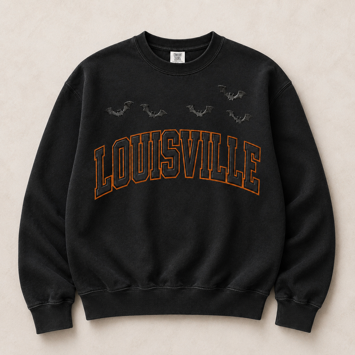Louisville Halloween blackout varsity crewneck in Black — orange-outlined LOUISVILLE arch with embossed bats, front flat lay
