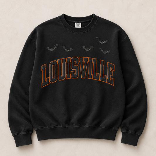 Louisville Halloween blackout varsity crewneck in Black — orange-outlined LOUISVILLE arch with embossed bats, front flat lay