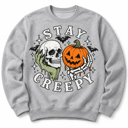Stay Creepy crewneck sweatshirt in Heather Grey — skull and jack-o'-lantern graphic with bats, front flat lay