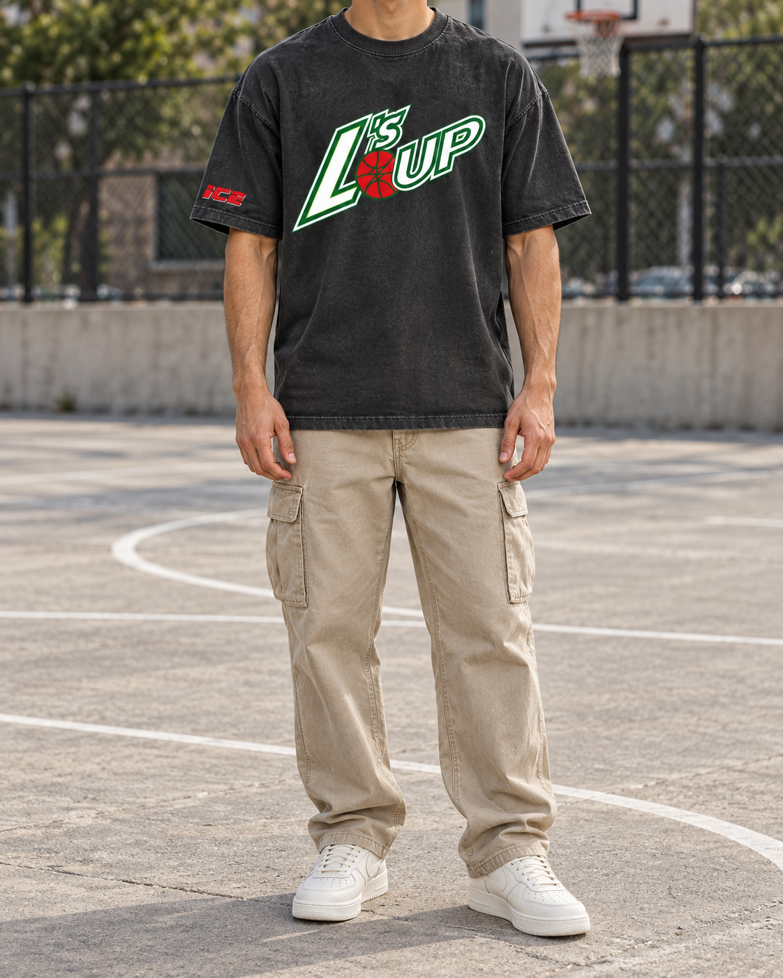 Man on an outdoor basketball court wearing the L's Up Comfort Colors tee in Black with khaki cargo pants and white sneakers