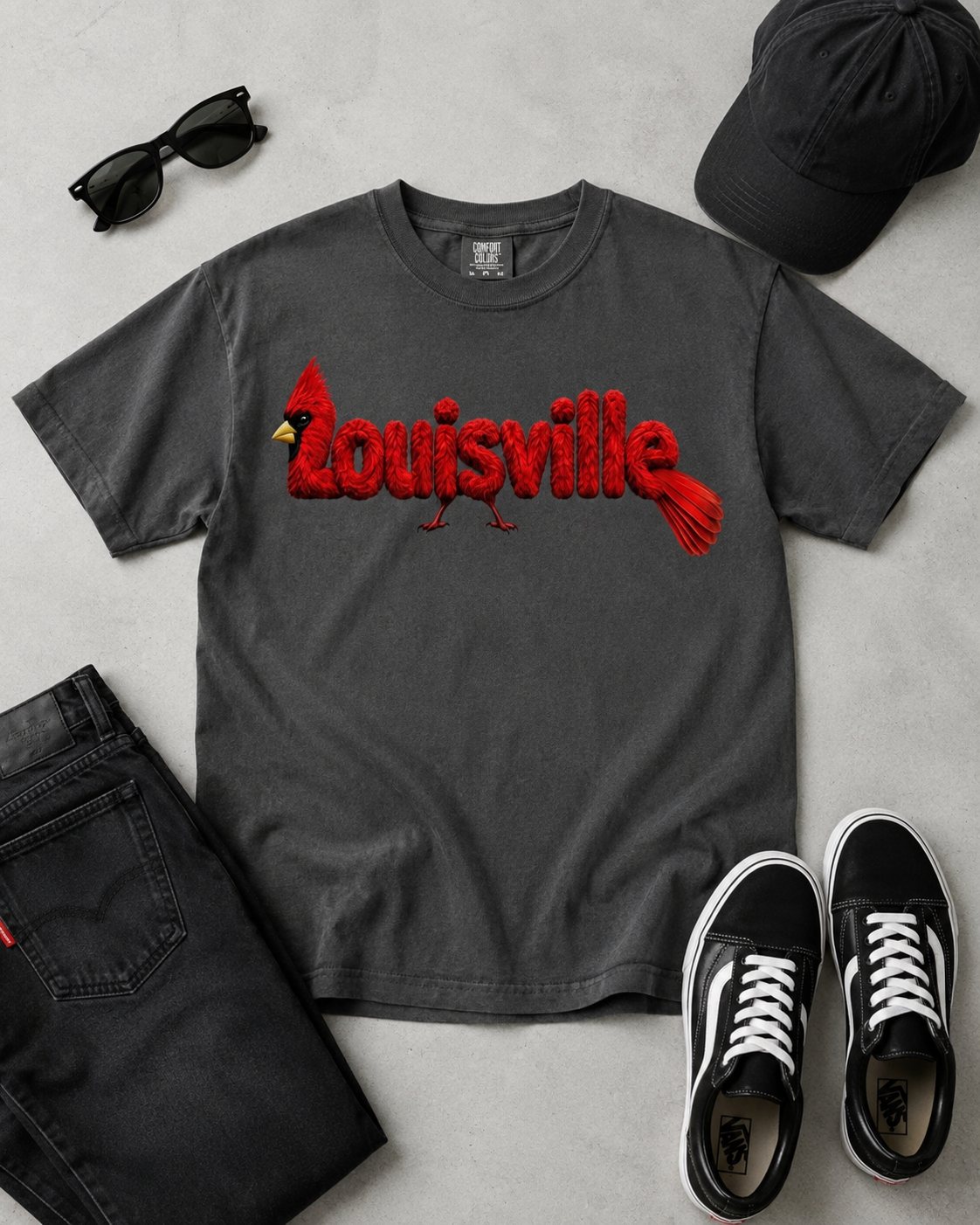 Louisville Cardinal feather-lettering tee — Pepper Comfort Colors flat lay