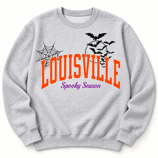Louisville Spooky Season crewneck sweatshirt in Heather Grey — orange LOUISVILLE arch, purple Spooky Season script, cobweb and bats, front flat lay