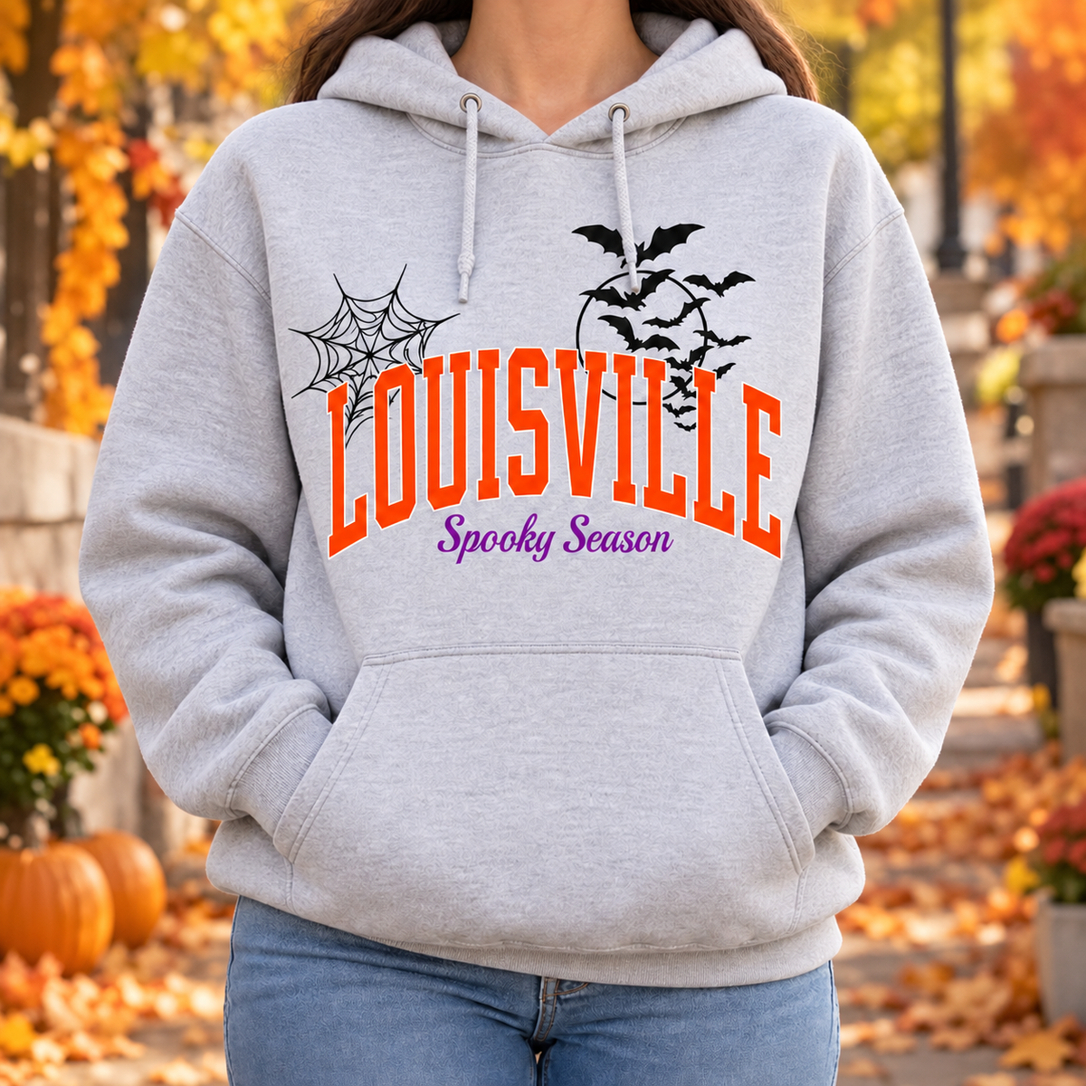 Louisville Spooky Season hoodie in Heather Grey — worn on model outdoors in fall