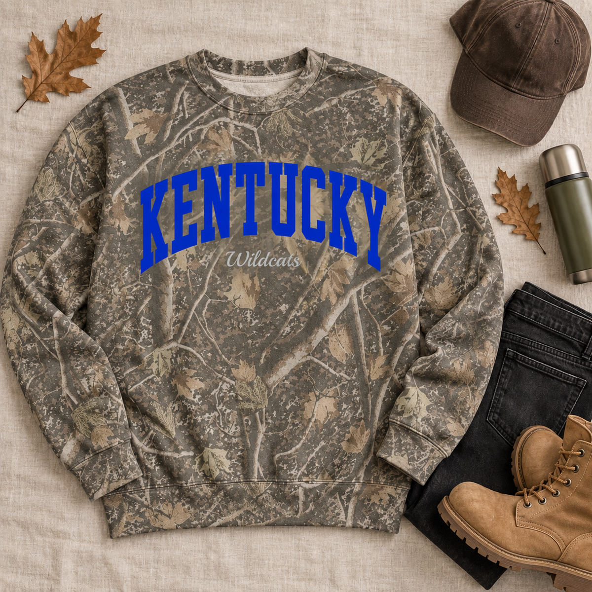 Kentucky Wildcat camo crewneck — styled fall flat lay with camo cap, jeans and thermos