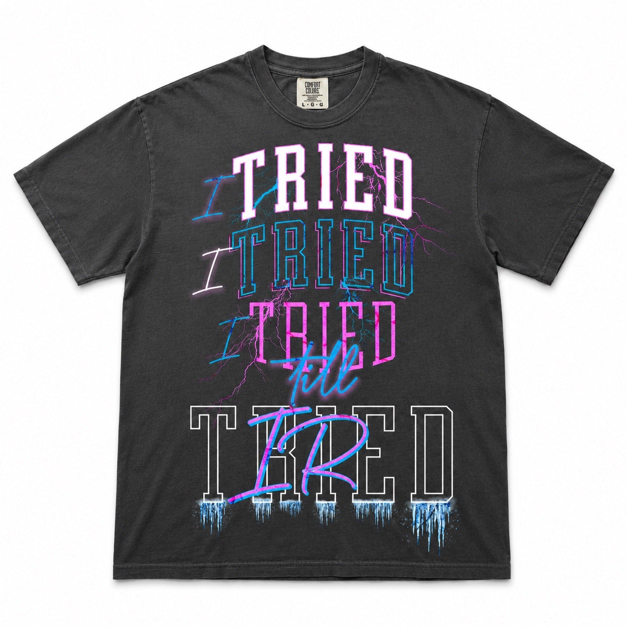I Tried Till Tired graphic tee — charcoal pink and blue flat lay mockup