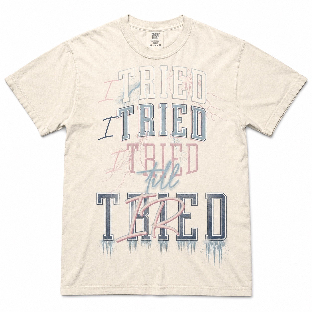 I Tried Till Tired graphic tee — ivory Comfort Colors flat lay mockup