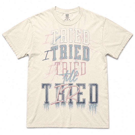 I Tried Till Tired graphic tee — ivory Comfort Colors flat lay mockup